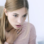 what can cause the feeling of something stuck in throat