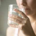 woman drinking water for diarrhea