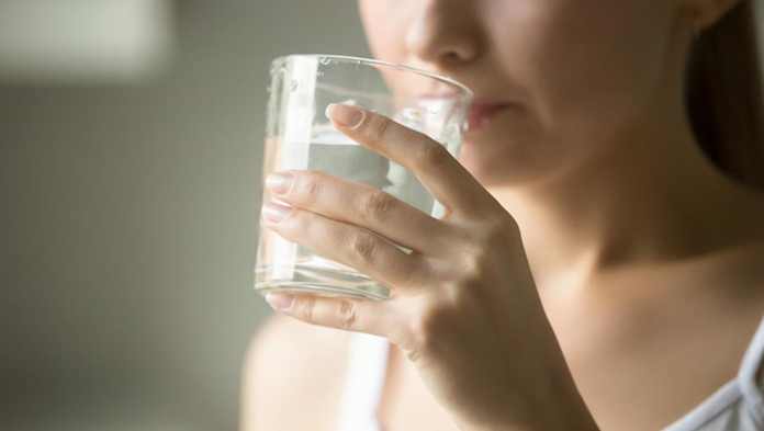woman drinking water for diarrhea