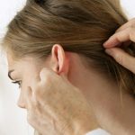 what causes lumps or cysts behind ears