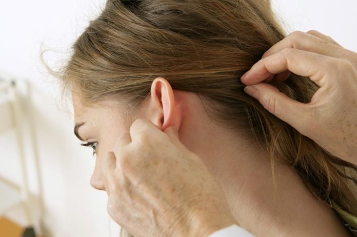 what causes lumps or cysts behind ears